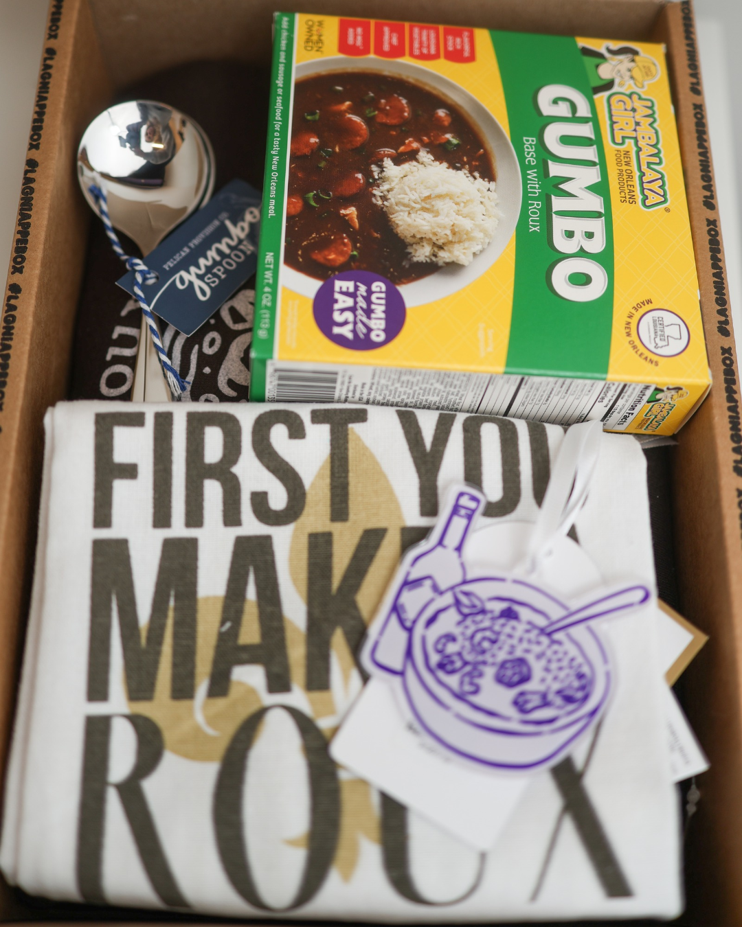 Everything in the Gumbo Roux La La Gift Set: Roux La La Sweatshirt, First You Make A Roux tea towel, gumbo spoons, Jambalaya Girl gumbo base and gumbo ornament