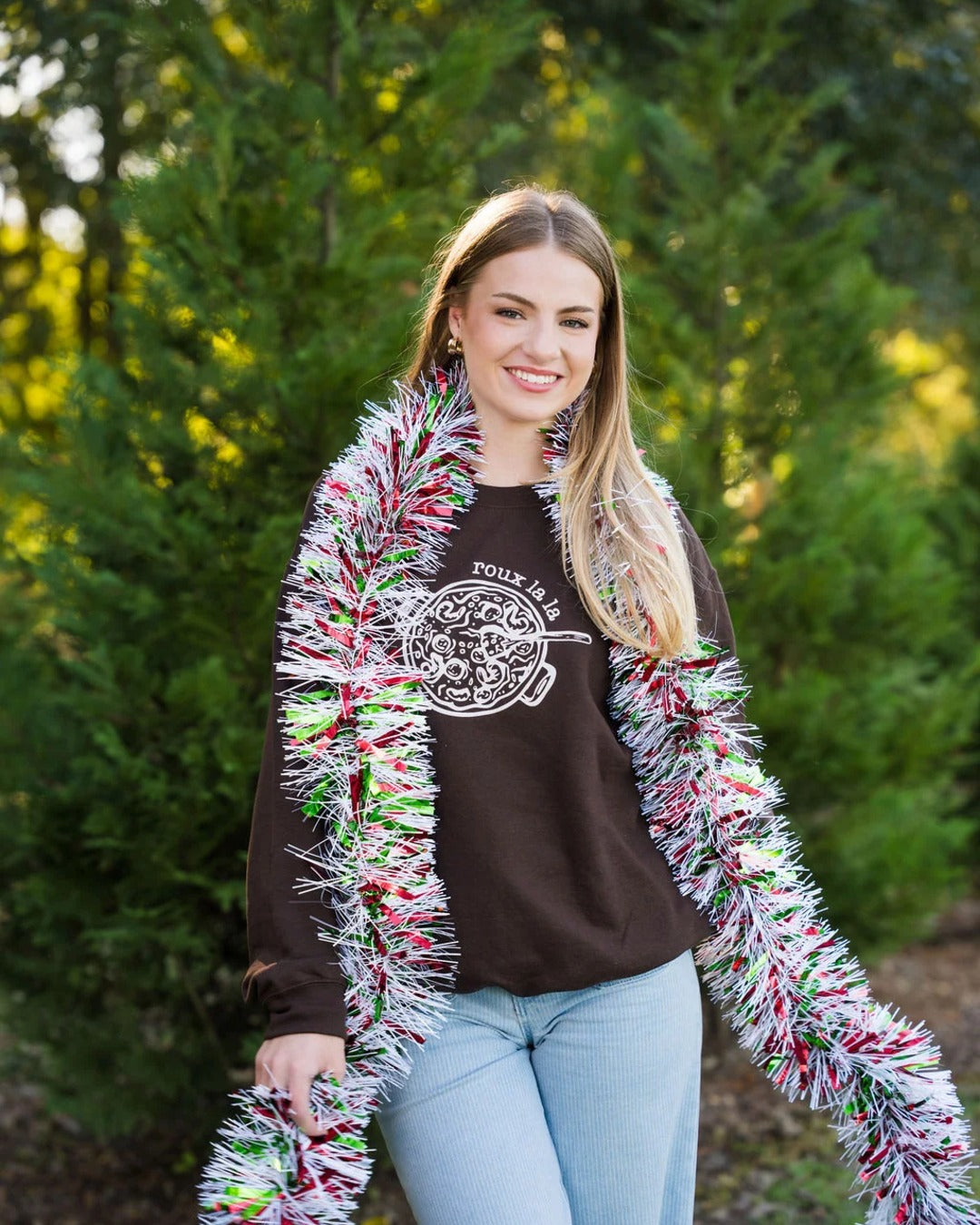 Roux La La Sweatshirt styled with a festive tinsel boa for the holidays