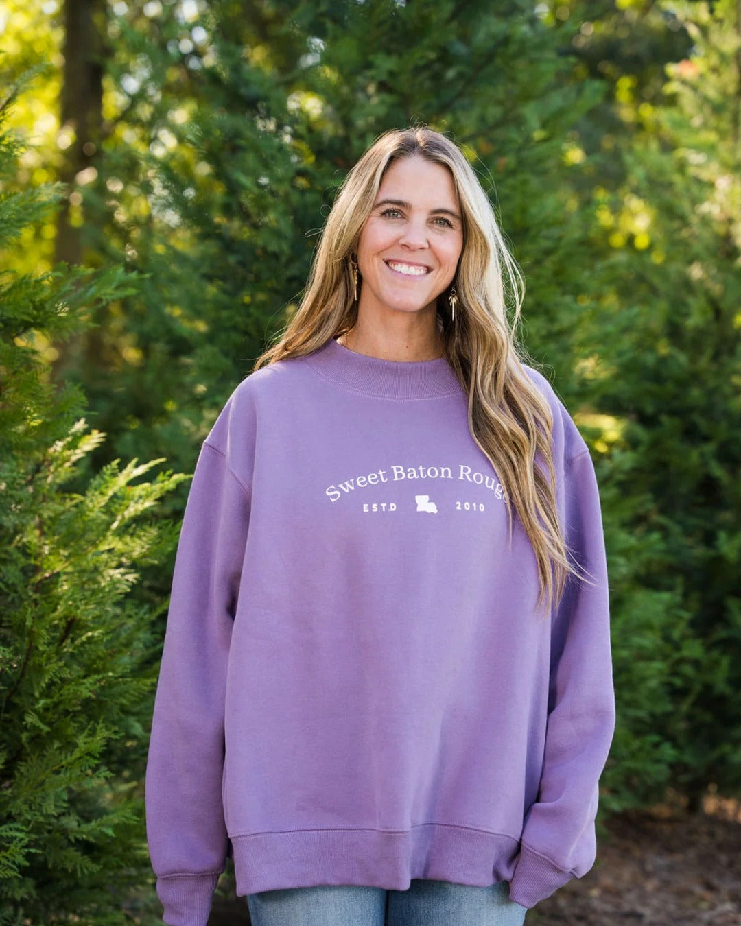 Oversized fit of the Sweet Baton Rouge Travels Mock Neck Sweatshirt in Sweet 16 Purple
